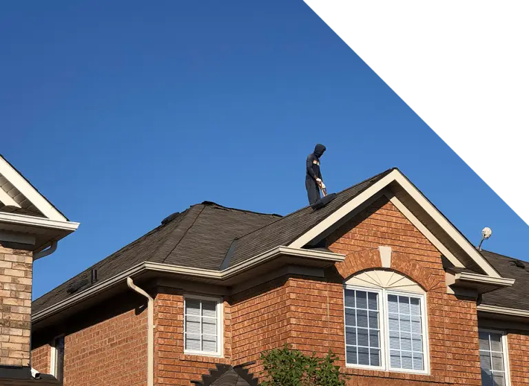 The Roofing Company - Our employee repairing on Milton roof